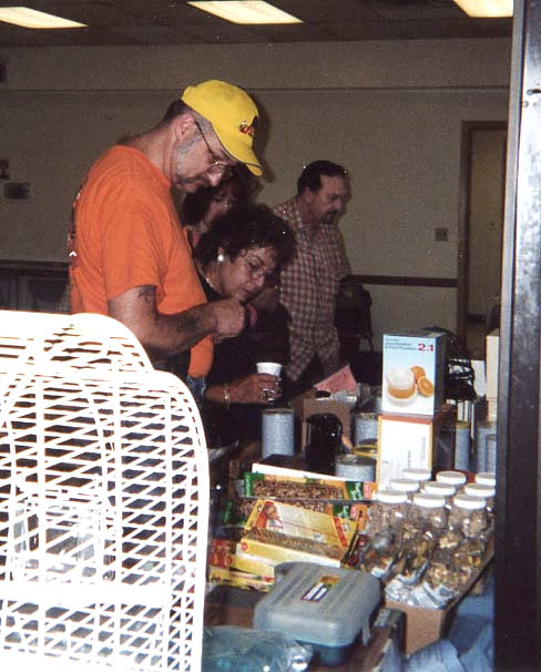 Mystery Man, Joan Mills & Joe Sabella at Raffle Table